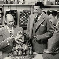 Three Businessmen with Gift